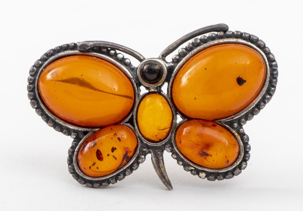 Signed A.S. Silver Amber Butterfly Brooch: Signed "A.S." Sterling Silver Amber Butterfly Motif Brooch, comprising six cabochon-cut amber; one 3mm round and five oval shaped amber ranging in size from 14 x10 mm to 7 x 5 mm, marked: "925 / AS"