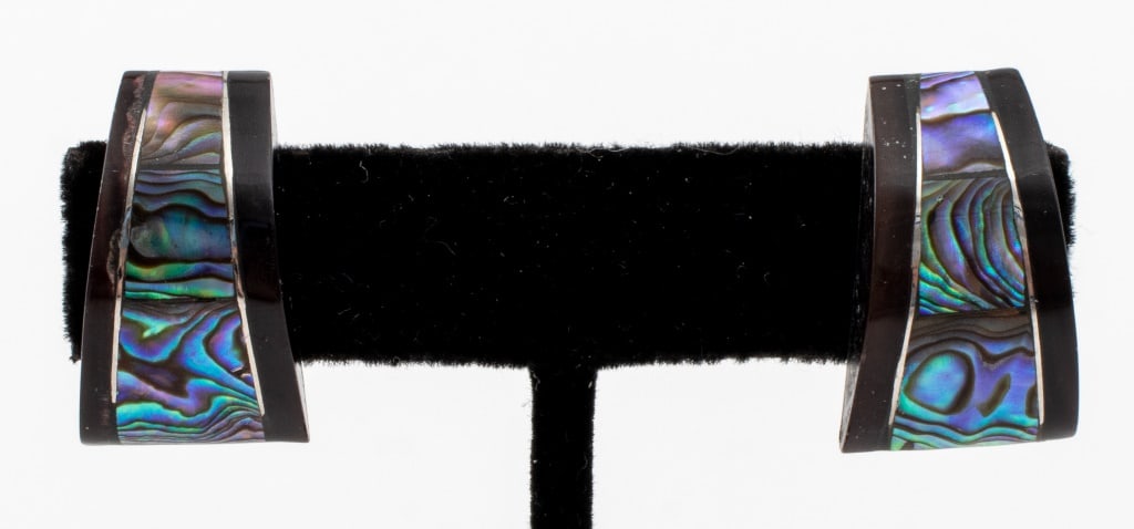 Silver-Tone Mother-of-Pearl & Onyx Clip Earrings: Pair of Silver-Tone Mother-of-Pearl Shell Inlay and Onyx Clip Earrings. 1.0" L x 0.562" W x 0.562" H. Provenance: Property from an 1199 Park Ave Estate. Keywords: Jewelry, Mother-of-Pearl, Fashion,