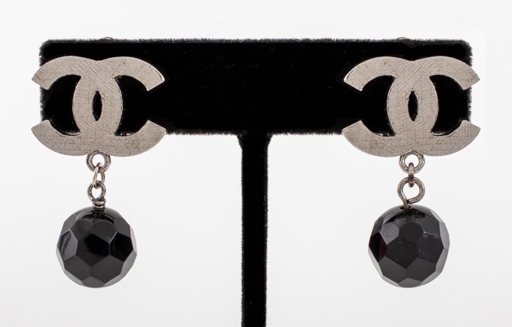 Chanel Runway Drop Clip Earrings, 2010: Pair of Chanel Runway Gunmetal-Tone Drop Clip Earrings, 2010, with faceted black beads suspended from signature double-CC logos, marked "(c) CHANEL (R) / 10 CC V / MADE IN FRANCE" to reverse. 1" L x