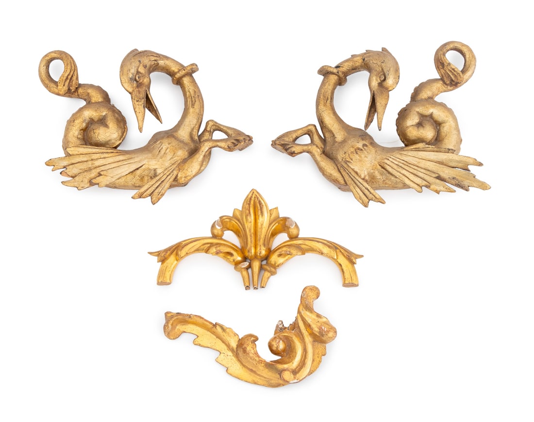 European Giltwood Architectural Elements, 4: Group of Four European Giltwood Architectural Elements, 19th century, comprising: a pair of IItalian Hippocamp appliques, and two scrolling floral appliques. Largest: 11" H x 11.25" W x 2.75" D. Prove