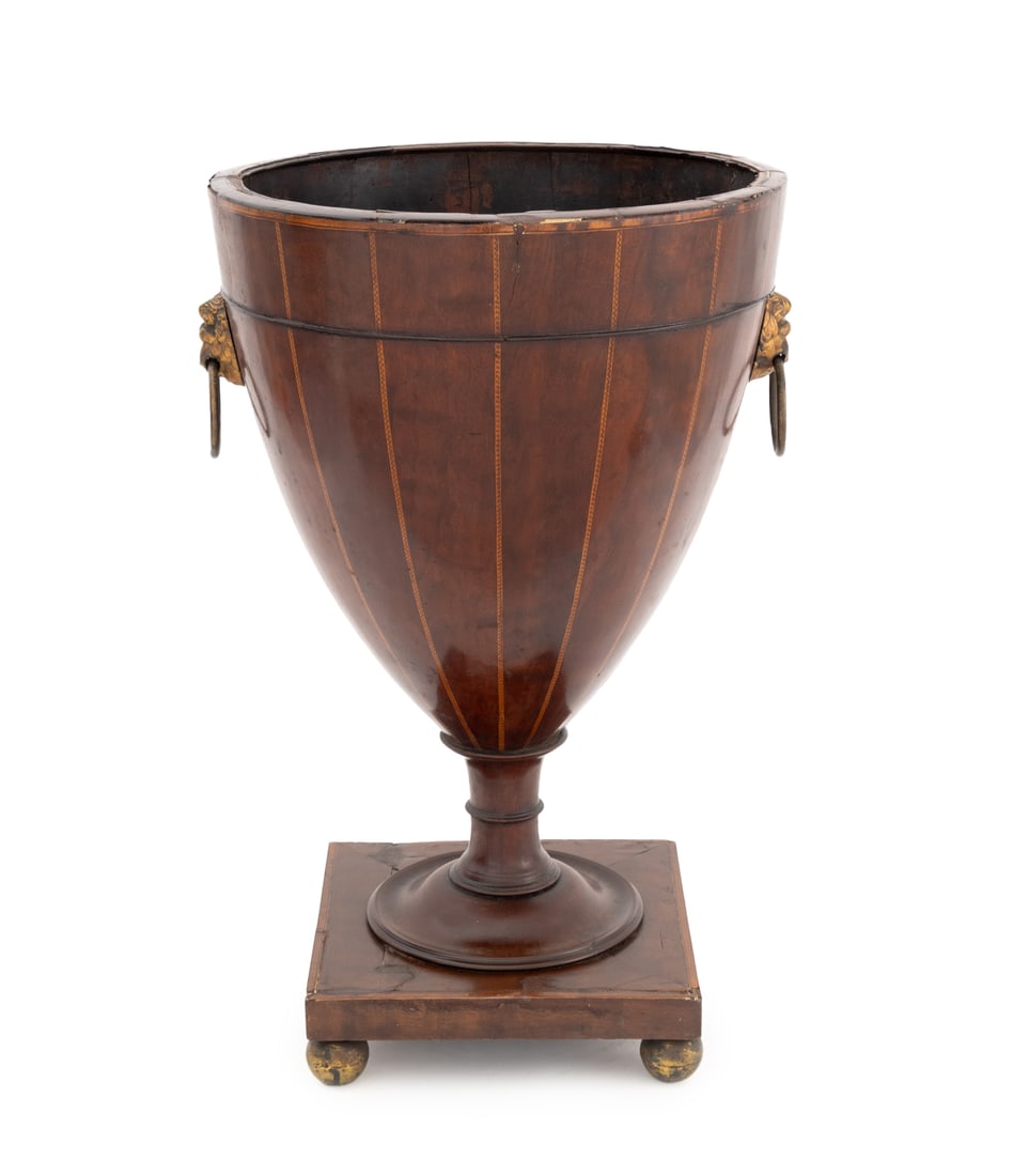 Victorian String Inlaid Mahogany Urn: Victorian String Inlaid Mahogany Urn, with brass lion head ring handles mounted on square base with four bun feet. 21" H x 14" Diameter. Provenance: From a Greenwich, Connecticut Estate. Keywords: Ant