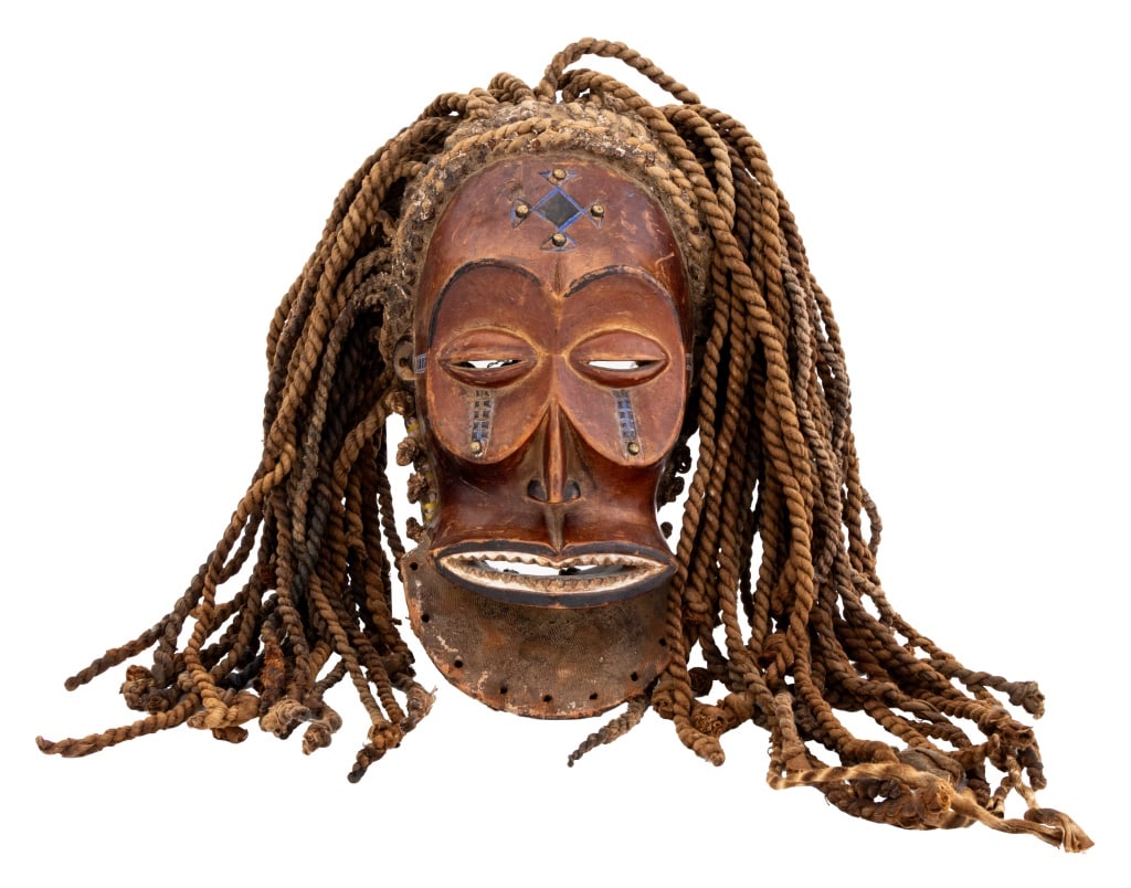 African Chokwe Metal Mounted Carved Wood Mask: African Chokwe Metal Mounted Carved Wood Mask, with rope hair and cobalt blue painted details. 18.5" H x 15" W x 8" D. Provenance: From a Fifth Avenue Estate. Keywords: African Art, Democratic Republi