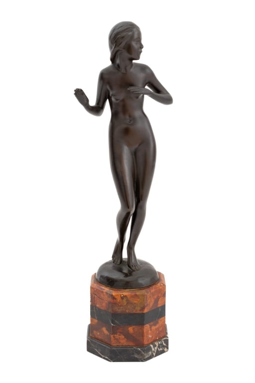 Lissy Eckart Standing Nude Woman Bronze Sculpture: Lissy Eckart (German, 1891-1974) Standing Nude Woman Patinated Bronze Sculpture, monogrammed and marked "Reiter Munchen" to reverse, mounted on octagonal red and black marble plinth. Overall: 12.75"