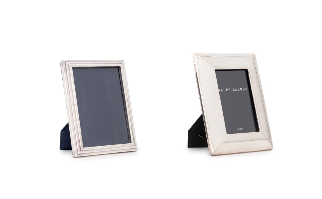 Ralph Lauren Silver Plate Picture Frames, 2: Two Ralph Lauren Silver Plate Picture Frames, each with "RL" plaque label to reverse. Larger: 8.5 H" x 6.75" W x 4.75" D. Provenance: From a Long Island Estate. Keywords: Designer, Easel frames, Memor