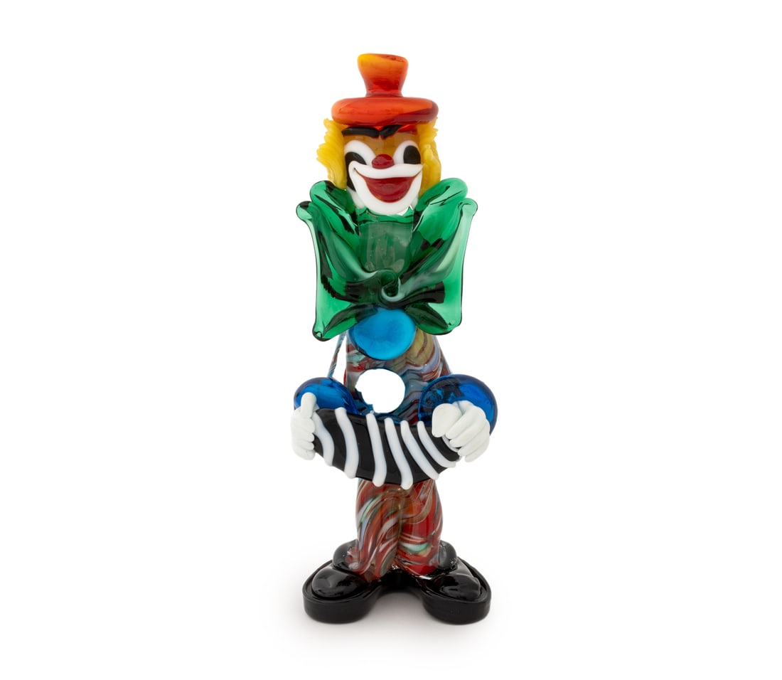 Murano Art Glass Clown Sculpture: Murano Art Glass Clown Sculpture, the figure holding an accordion, unmarked. 9" H x 3.5" W x 2.75" D. Provenance: From a Greenwich, Connecticut Estate. Keywords: Ventian glass, Studio glass, Italian g