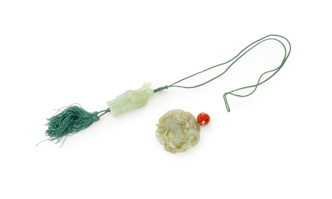 Chinese Celadon Jade Carvings, 2: Group of Two Chinese Celadon Jade Carvings, comprising: a figure of Shouxing strung on green silk cord, and a pierced dragon motif disc with red coral bead. Disk: 2.75" Diameter x 0.5" D. Provenance:
