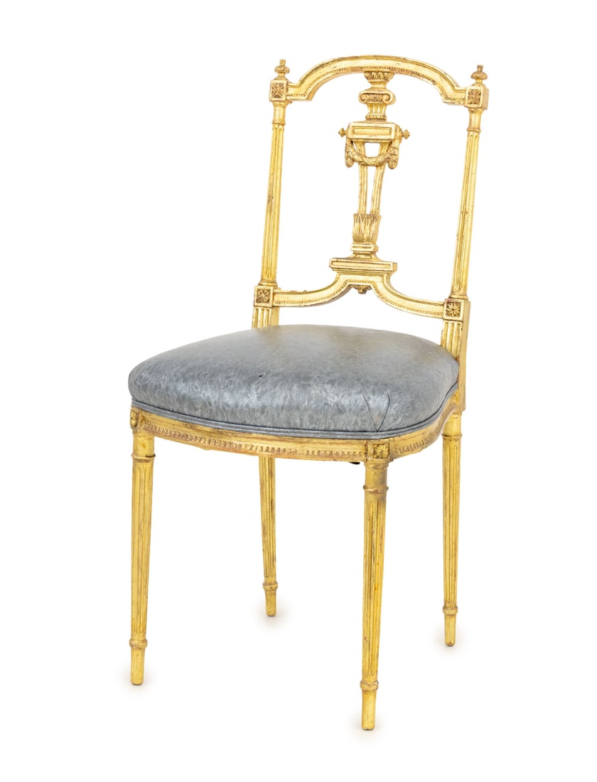 Louis XVI Style Giltwood Side Chair, ca. 1900: Louis XVI Style Giltwood Side Chair, circa 1900, with metallic silver-tone upholstered seat. 32" H x 16" W x 17" D; seat: 18" H. Provenance: From an 880 Fifth Avenue Collection. Keywords: French