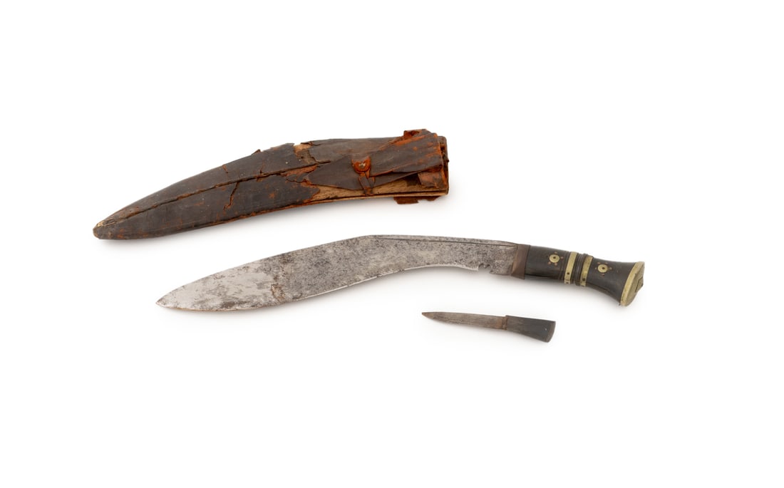 Nepalese Gurkha Kukri Knife: Nepalese Gurkha Kukri Knife, with leather covered scabbard and smaller knife, the horn handle with mixed metal details. Sheathed: 17" L x 4.5" W x 2" D. Provenance: From a Greenwich, Connecticut