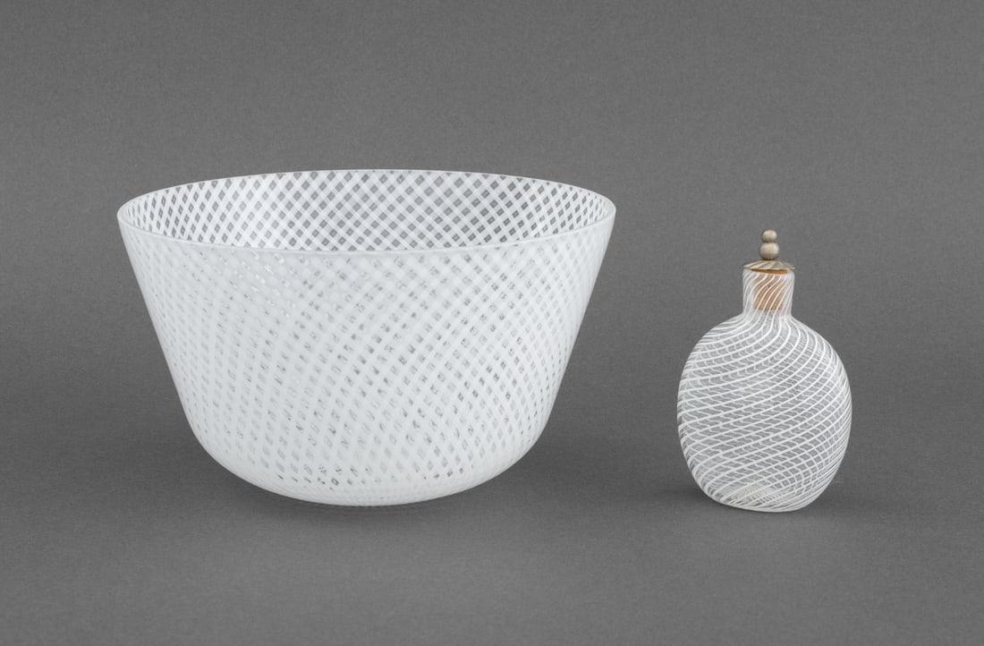 Murano Latticino Art Glass Vessels, 2: Two Murano White Latticino Art Glass Pieces, comprising: a bowl and a stoppered perfume bottle. Larger: 4.25" H x 7.25" Diameter. Provenance: From the Collection of Laura and Lewis Kruger. Keywords: