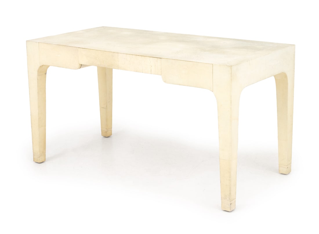 Karl Springer White Shagreen Writing Desk: Karl Springer White Shagreen Covered Writing Desk, the rectangular top above frieze drawer flanked by two short drawers on four square tapered legs, "Karl Springer / Made in the Philippines" plaque to