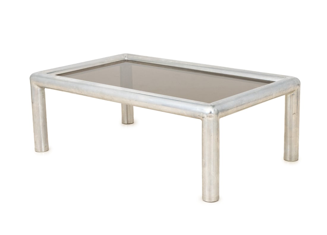 John Maschernoi "Tubo" Aluminum Coffee Table: John Maschernoi "Tubo" Aluminum Coffee Table, the tubular frame with smoky glass top. 17.5" H x 48" W x 29.5" D. Provenance: From the Estate of American Fashion Journalist and Editor-in-Chief of Vogue