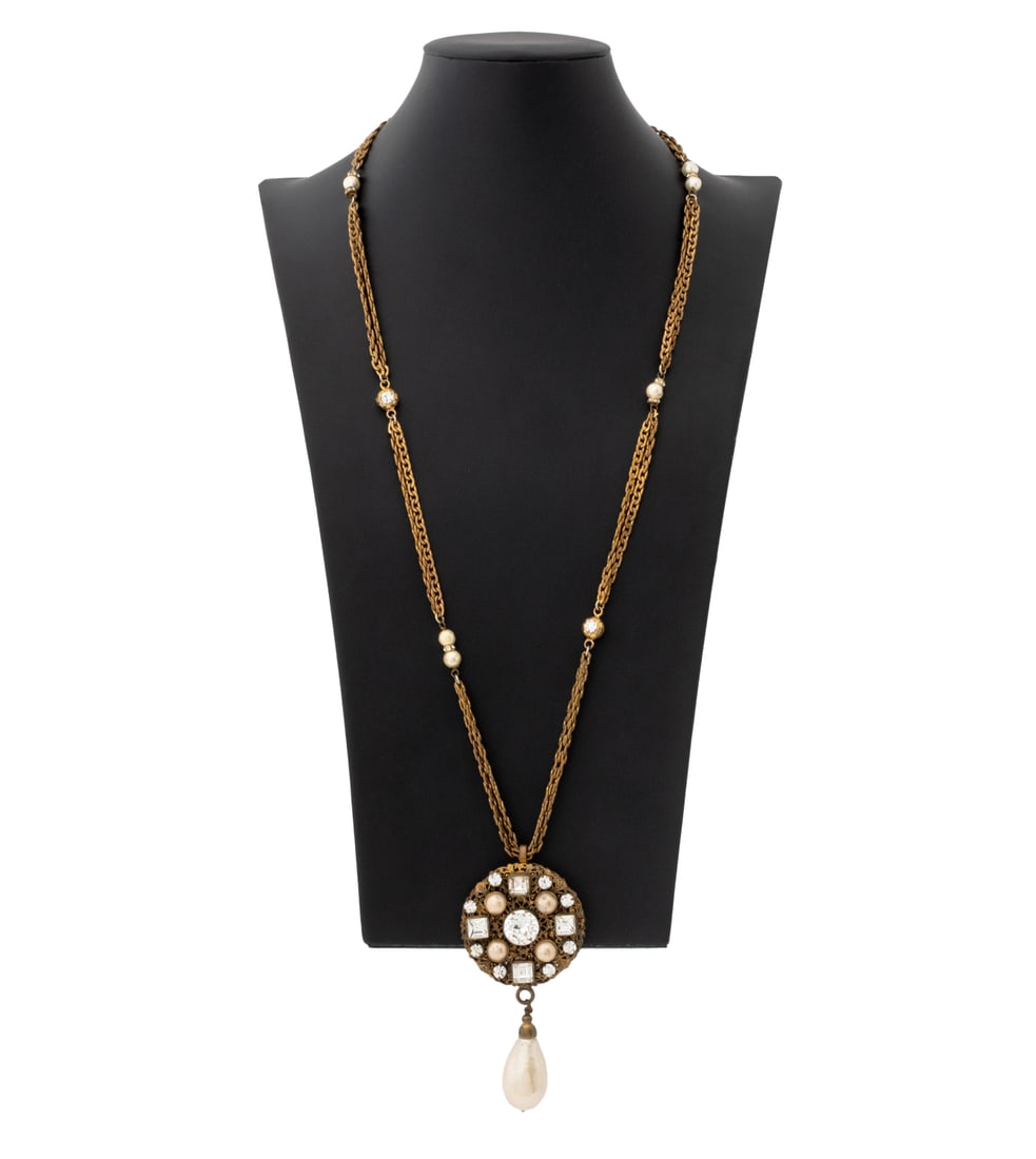 Chanel Runway Gem-Set & Faux Pearl Necklace: Chanel Runway Gem-Set and Faux Pearl Mounted Gold-Tone Metal Necklace, 1983, the filigree pendant with faux Baroque pearl drop and marked "Chanel / CC / 1983" to reverse. Chain: 32.5" L; pendant: 4.25