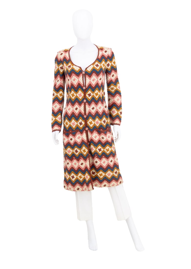 Emanuel Ungaro Couture Crocheted Long Cardigan: Emanuel Ungaro Couture Crocheted Long Cardigan, in diamond and floral pattern with two front pockets, and seven flower buttons, "Emanuel Ungaro / Couture / Paris" label. Overall length: 42.5";