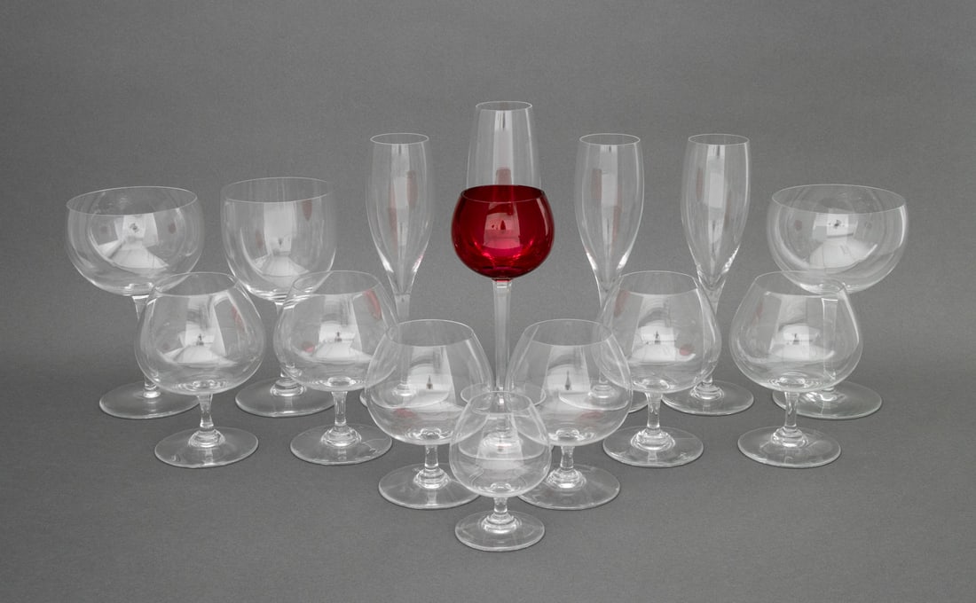 Baccarat Crystal Stemware, 15 Pcs.: Group of 15 Baccarat Crystal Stemware Pieces, each marked "Baccarat France" and comprising: four champagne flutes, seven snifters, one diminutive and two smaller, three wine glasses, and one ruby red