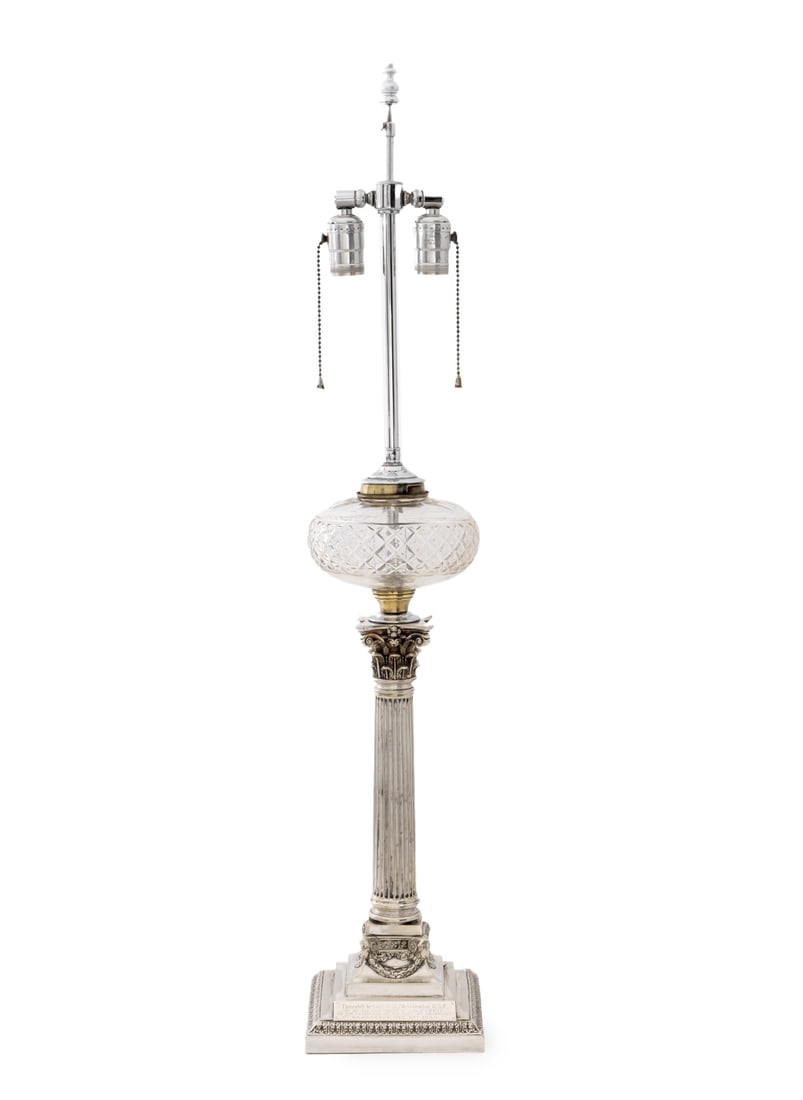 Corinthian Column Candlestick Mounted as a Lamp: Corinthian Column Silver Plate Candlestick Mounted as a Table Lamp, atop a tiered square base with ram head details, with cut crystal accent below two bulb fittings, plaque engraved "Presented to Capt