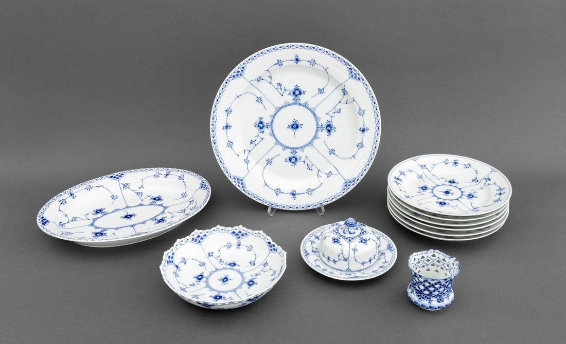 Royal Copenhagen Porcelain Tableware, 11 Pcs.: Set of 11 Royal Copenhagen Porcelain "Half Lace" Tableware Pieces, comprising: (6) luncheon plates, circular serving platter, overal serving platter, fruit bowl with pierced rim, covered circular butt