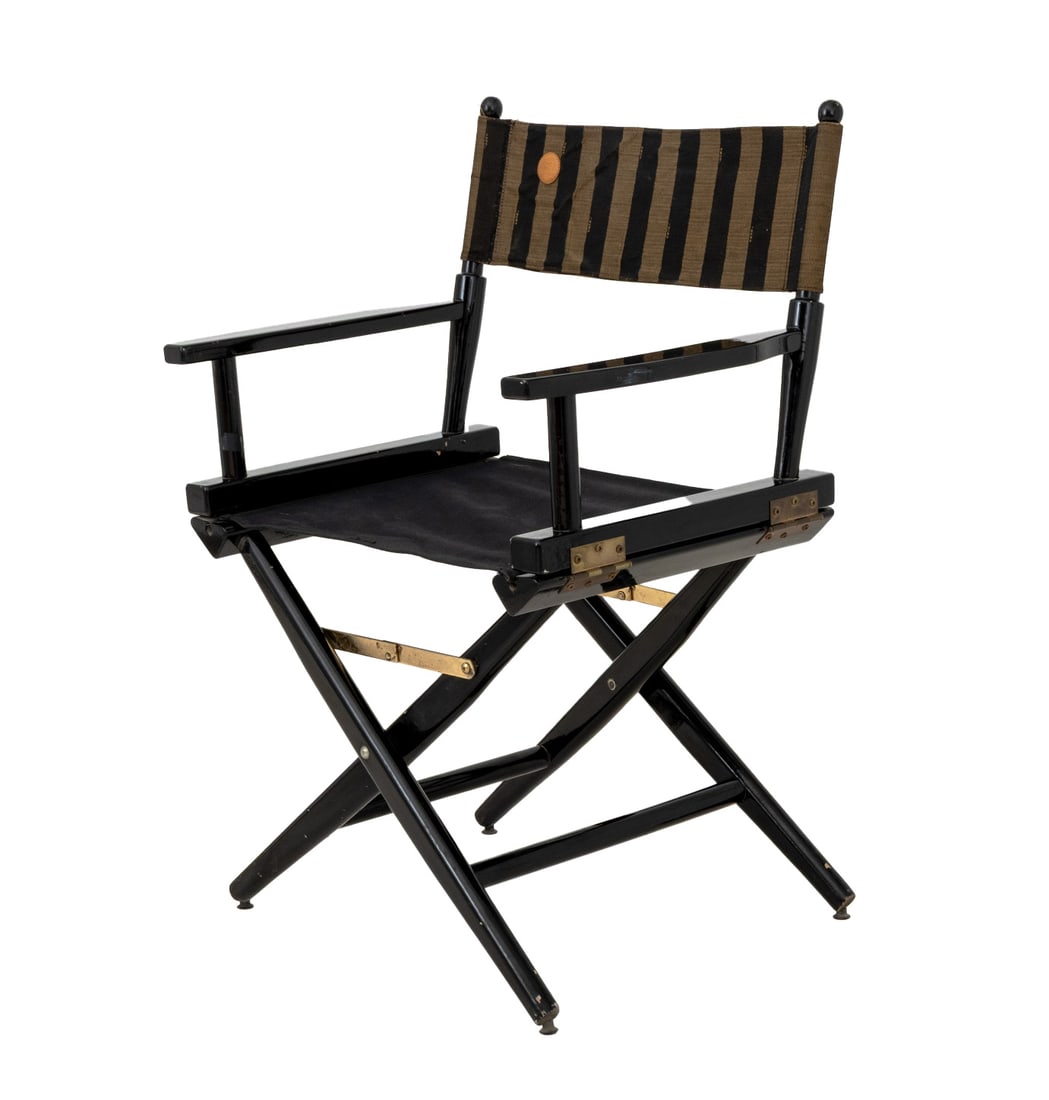 Fendi Ebonized Wood Director's Chair: Fendi Ebonized Wood Director's Chair, the collapsible frame with an X-form stretcher and striped cotton Fendi backrest, embroidered "Grace" with "Fendi" logo to the front. 33.5" H x 18.5" W x 16" D; s