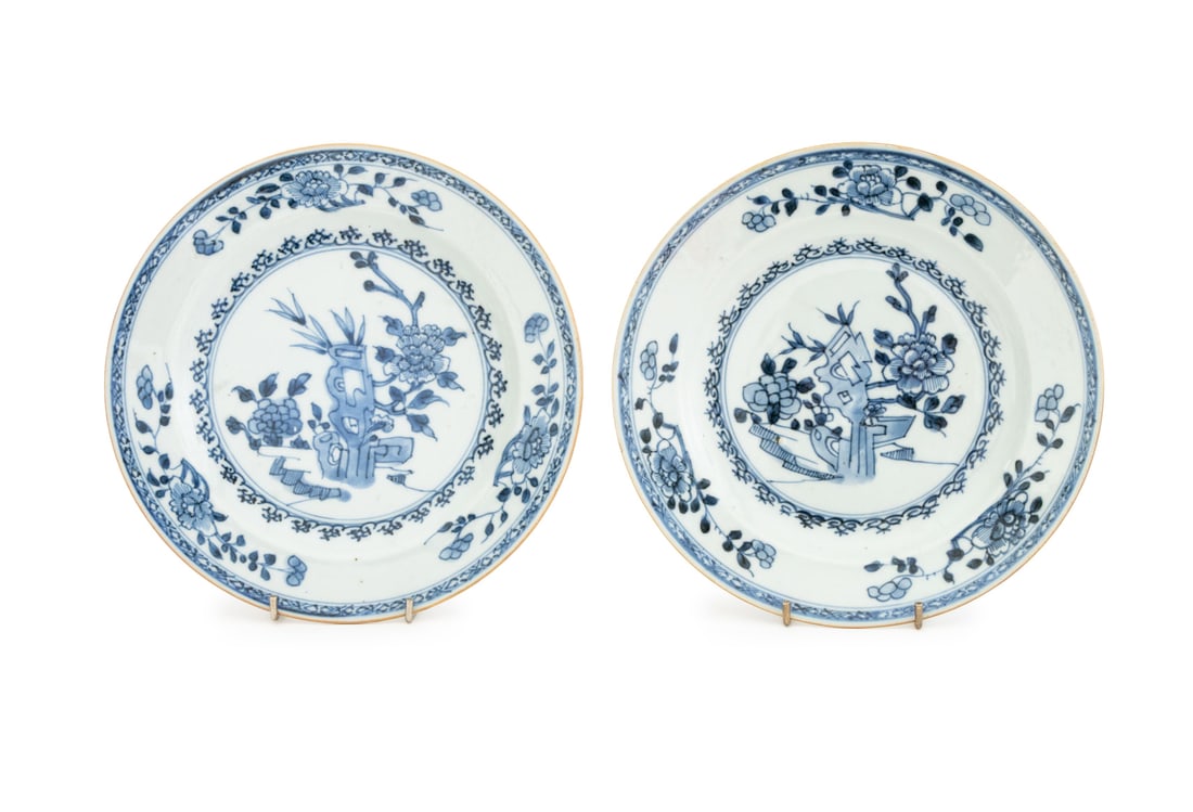 Chinese Blue & White Porcelain Plates, Pair: Pair of Chinese Blue and White Porcelain Plates, circa 1800, with hand-painted floral decoration. 9" Diameter. Provenance: From the Estate of American Fashion Journalist and Editor-in-Chief of Vogue (
