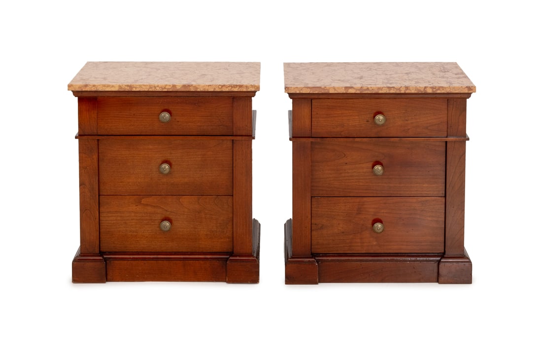 Red Marble Top Walnut Bedside Tables, Pair: Pair of Red Marble Top Walnut Bedside Tables, each with "Made exclusively for / Bloomingdale's" plaque label, three drawers, and brass pulls. 26" H x 24" W x 15.5" D. Provenance: From the Estate of Am