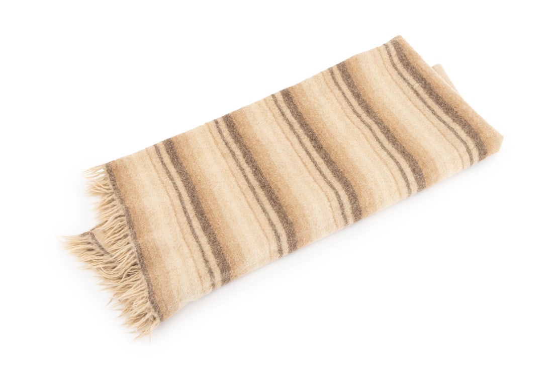 Alpaca Wool Throw Blanket: Alpaca Wool Throw Blanket, with brown and beige stripes, with "100% Alpaca" label. 43" L x 59" W. Provenance: From the Estate of American Fashion Journalist and Editor-in-Chief of Vogue (1971-1988)