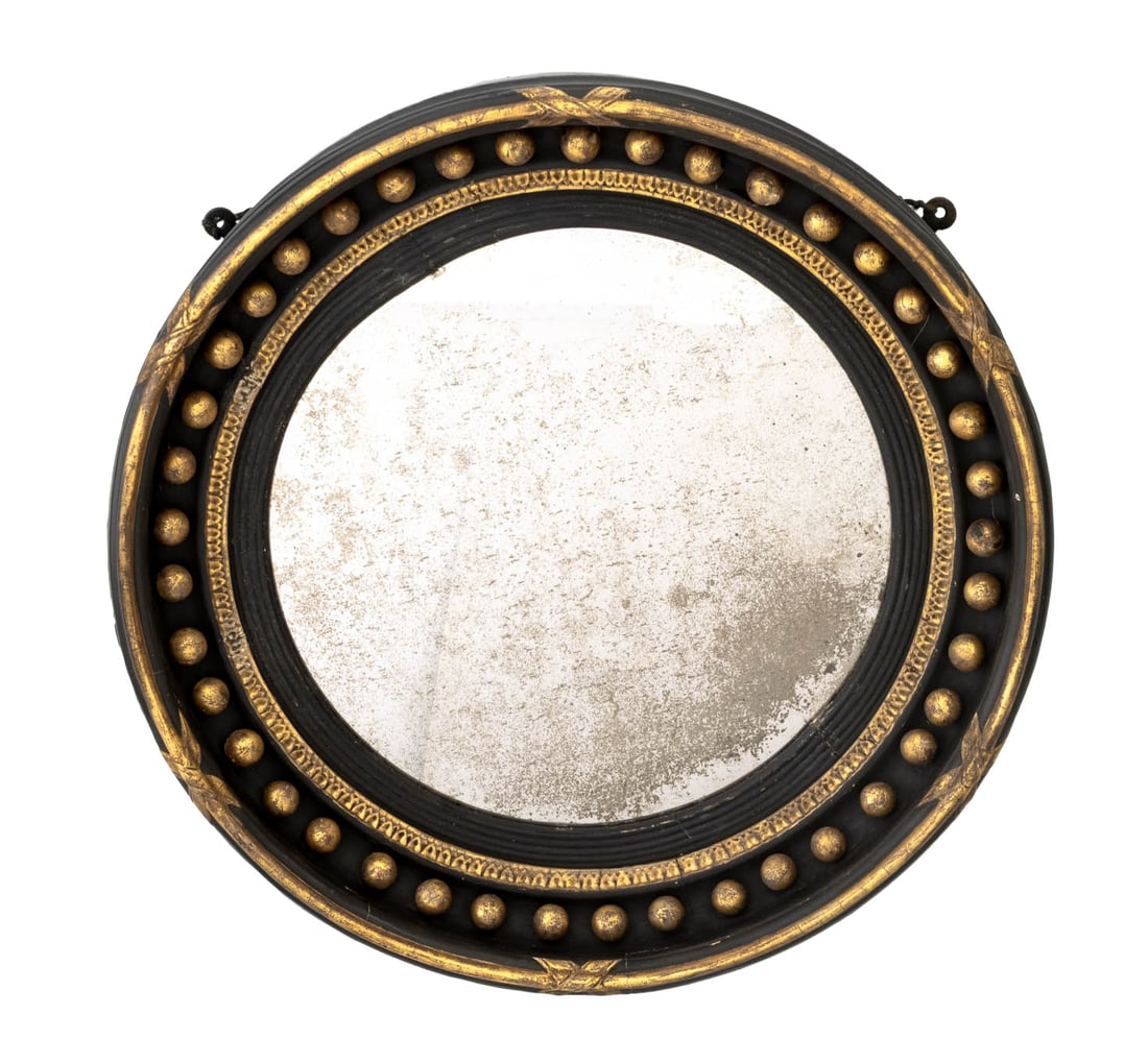 Regency Ebonized & Giltwood Convex Mirror: William Ferrand Regency Ebonized and Giltwood Round Convex Mirror, 19th century, with acanthus leaf and ball form accents, William Ferrand label verso. 21.5" Diameter x 3.5" D. Provenance: From a New