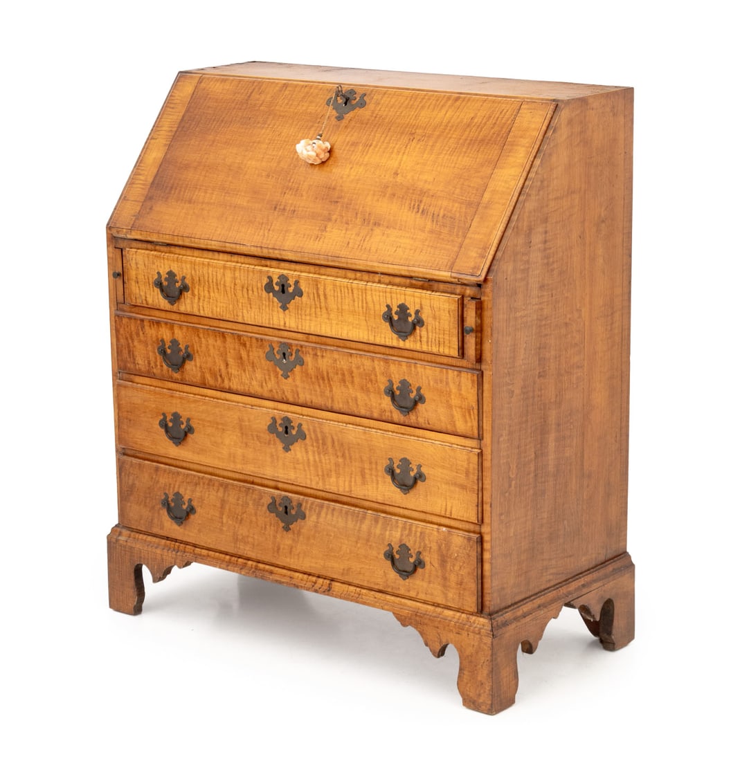 American Chippendale Tiger Maple Slant Front Desk: American Chippendale Tiger Maple Slant Front Desk, the top opening to writing surface, storage compartment with shell motif carving, and drawers above four drawers. Top closed: 40.75" H x 36.5" W x 17