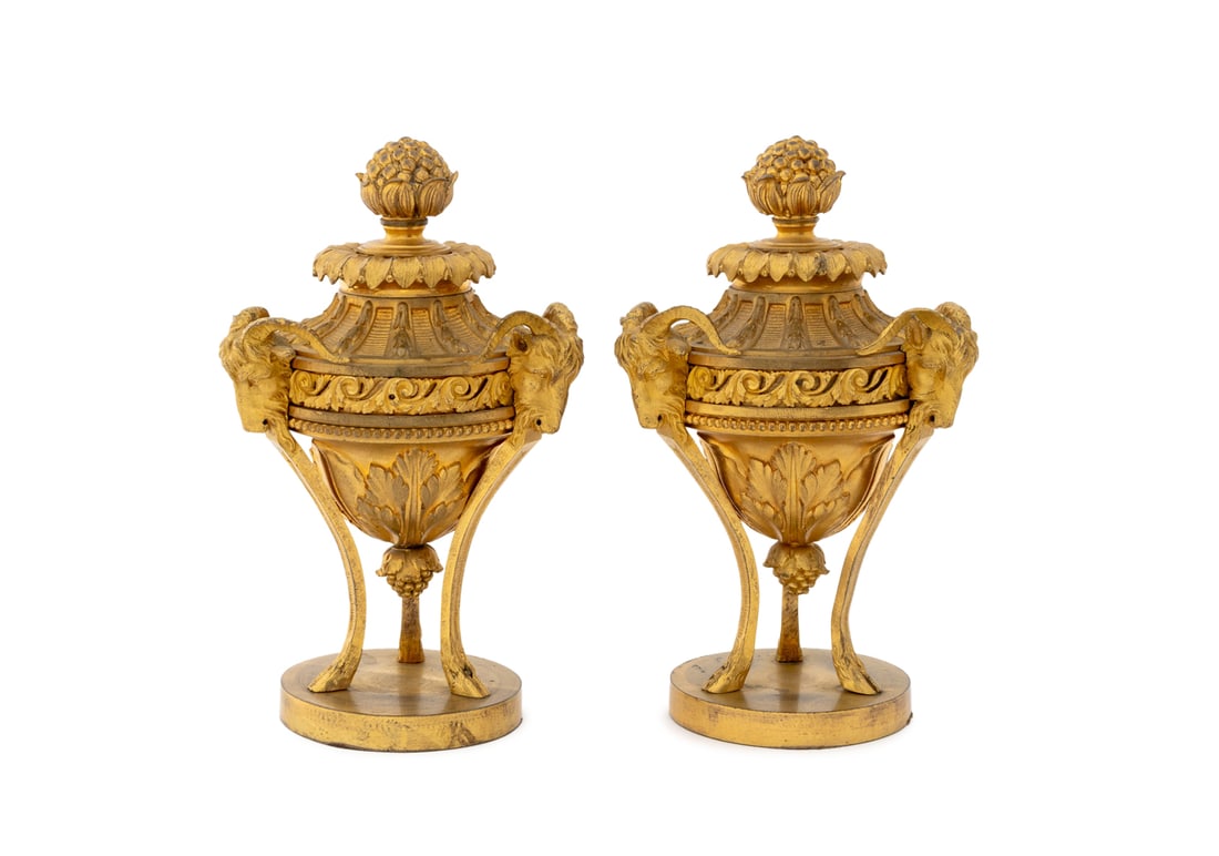Louis XVI Style Ram Head Motif Ormolu Urns, Pair: Pair of Louis XVI Style Ram Head Motif Ormolu Urn Sculptures, 19th century, each with berry bunch form finial above vasiform bodies atop three hoof form legs atop circular bases. 9.75" H x 5.5"