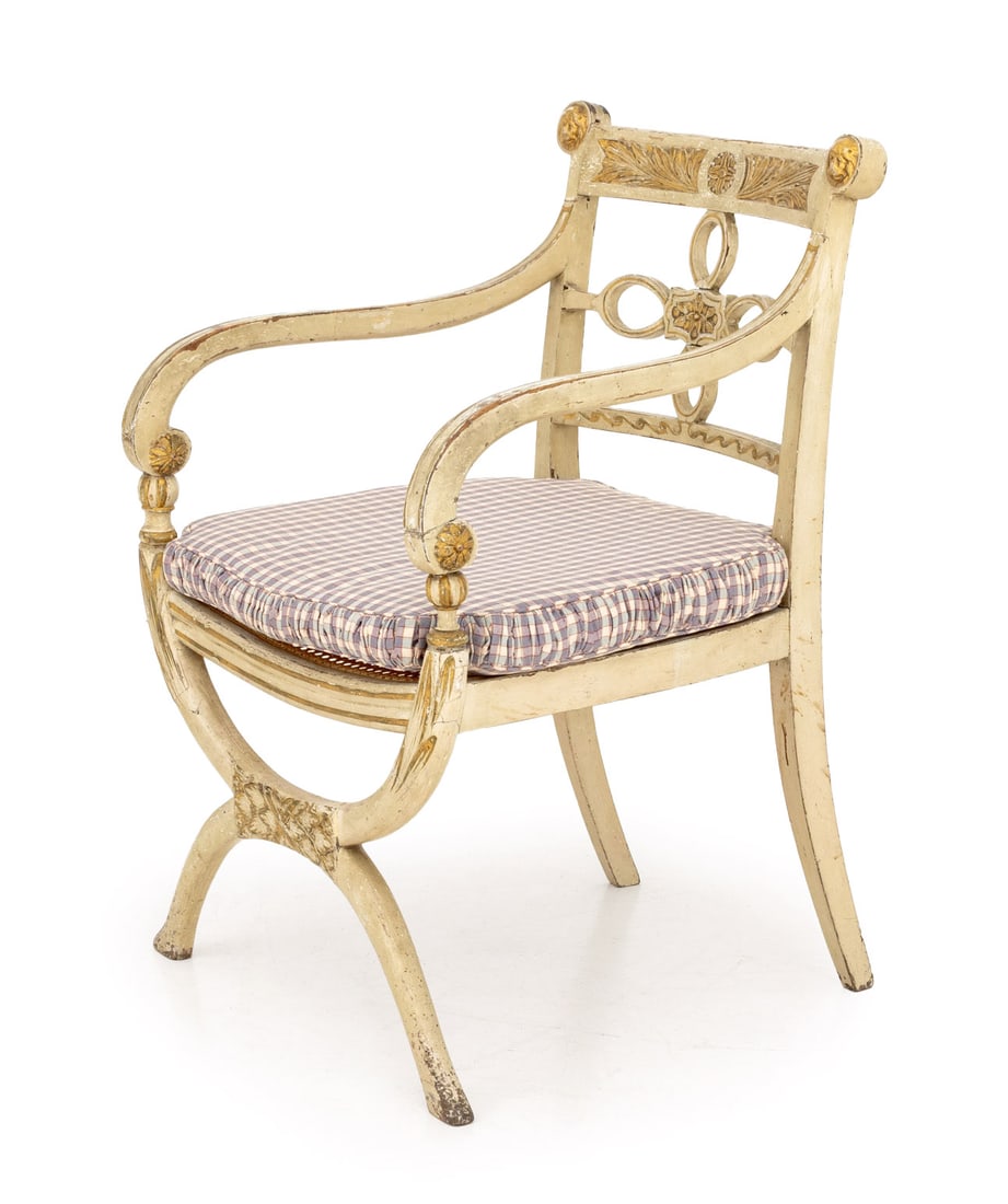 Regency White and Gilt Painted Caned Armchair: Regency White and Gilt Painted Cane Paneled Arm Chair, with plaid seat cushion. 32.5" H x 21" W x 21" D; arm: 25.5" H; seat: 17.5" H. Provenance: From a 955 Fifth Avenue Apartment. Keywords: Antique F