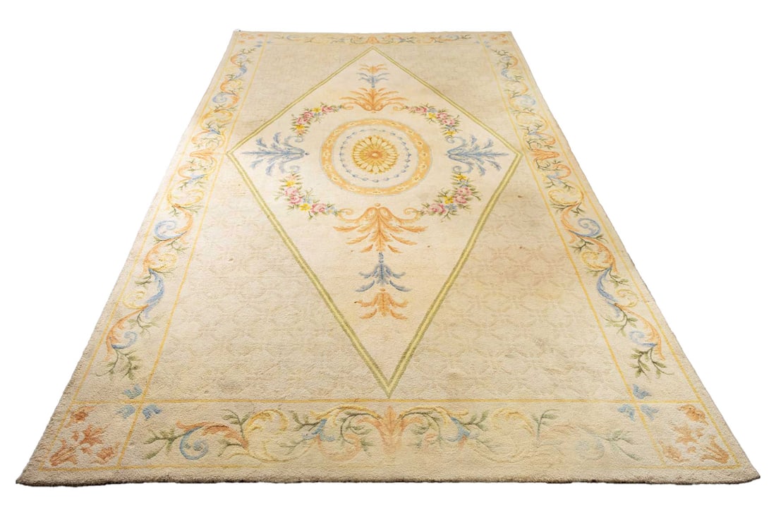 Savonnierie Style Palace Carpet, 21' 11" x 12' 2": Spanish Savonnierie Style Wool Palace Carpet, in beige with diamond crest and floral design with blue, green and orange foliate border, "Real Fabrices de de Tapices / Madrid" label to underside. 21' 1