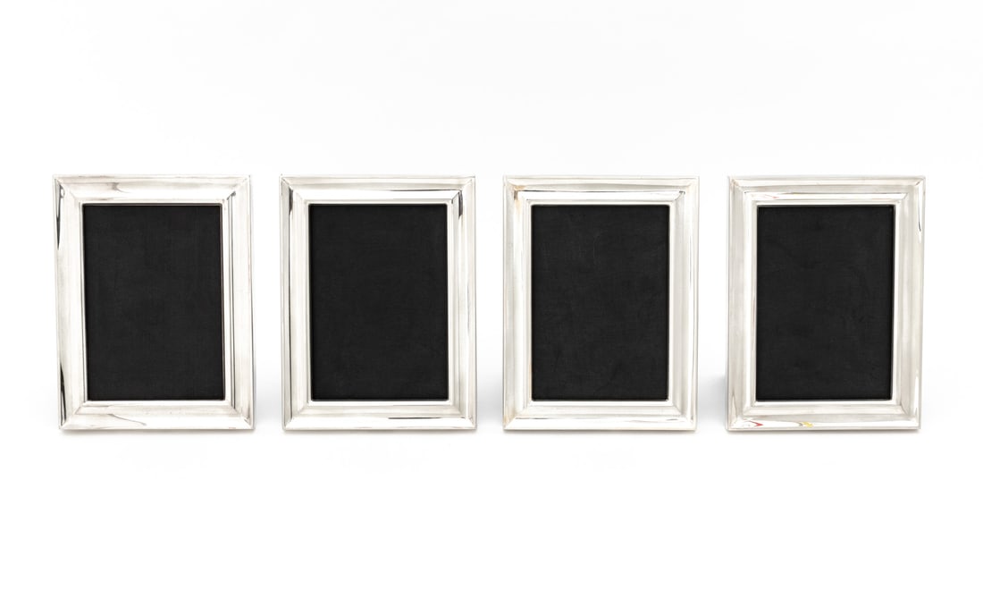 Ralph Lauren Silver Plate Picture Frames, 4: Collection of Four Ralph Lauren Silver Plate Picture Frames, each marked. 6.5" H x 8.5" W x 4.75" D. Provenance: From a Long Island Estate. Keywords: Designer, American design, Photograph frame,