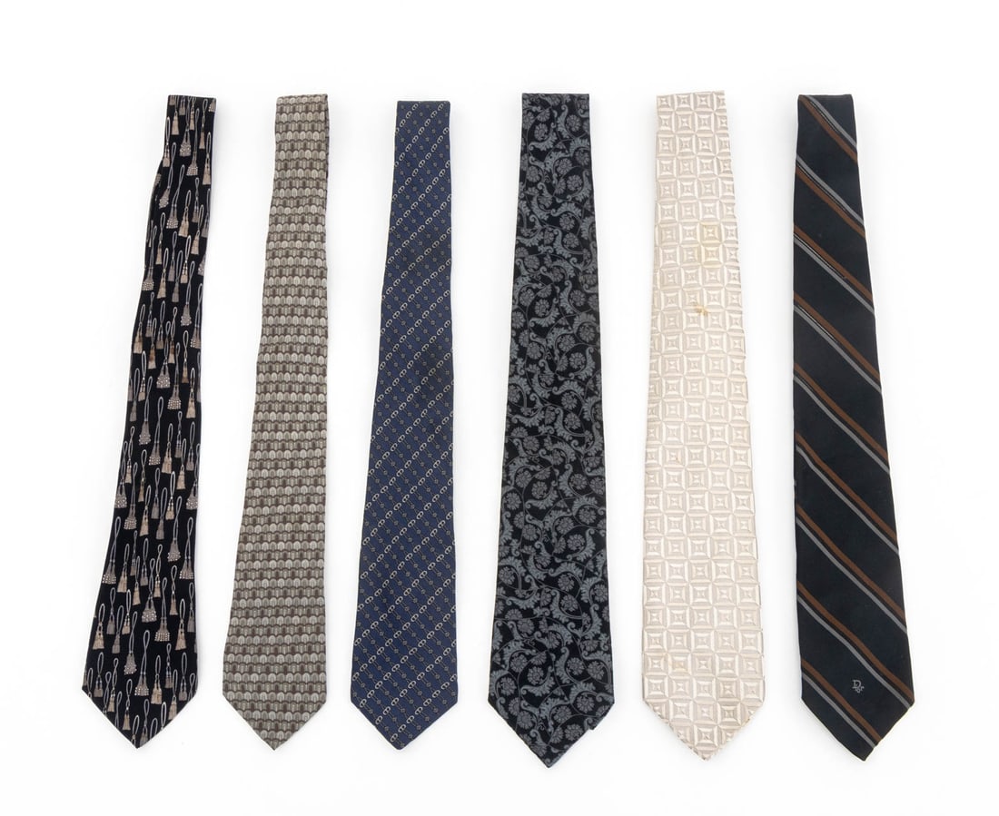 French Designer Silk Ties, 6: Group of Six French Designer Silk Ties, various prints and patterns, all marked and comprising: two Charvet ties, two Christian Dior Ties, one Jean Patou, and one Yves Saint Laurent. Each approx.: 60"