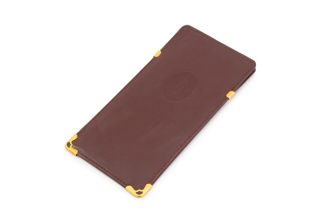 Cartier Gilt Metal Mounted Leather Glasses Case: Cartier Gilt Metal Mounted Leather Glasses Case, marked "Cartier / Paris" inside. 6.5" L x 3.25" W. Provenance: Property from a Bunny Williams decorated 5th Avenue Estate. Keywords: Designer, Luxury