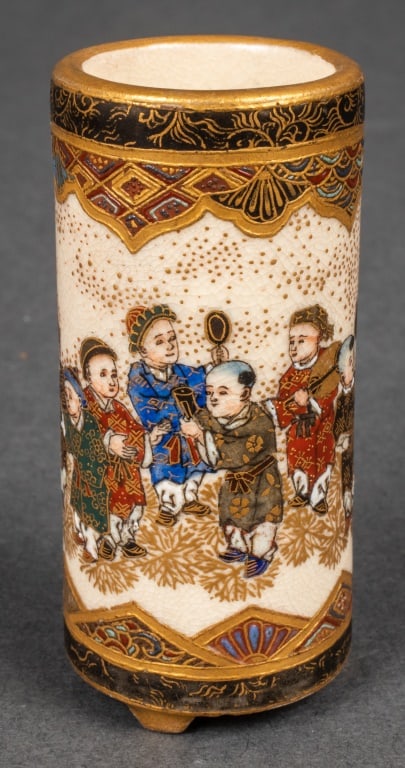 Japanese Satsuma Porcelain "Children" Vase: Japanese Satsuma Porcelain "Children" Miniature Vase, intricately hand-painted with scenes of children playing games, gilt signature underside. 2.375" H x 1" Diameter. Provenance: From a New York