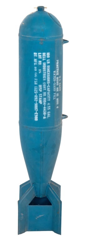 U.S. Navy MK 15 Model 4 Inert Practice Bomb, 1960s: United States Navy MK 15 Model 4 Inert Practice Bomb, 1960s, of typical torpedo form with fins, painted blue and with stenciled label to side. 42" H x 9" Diameter. Provenance: From the collection of L