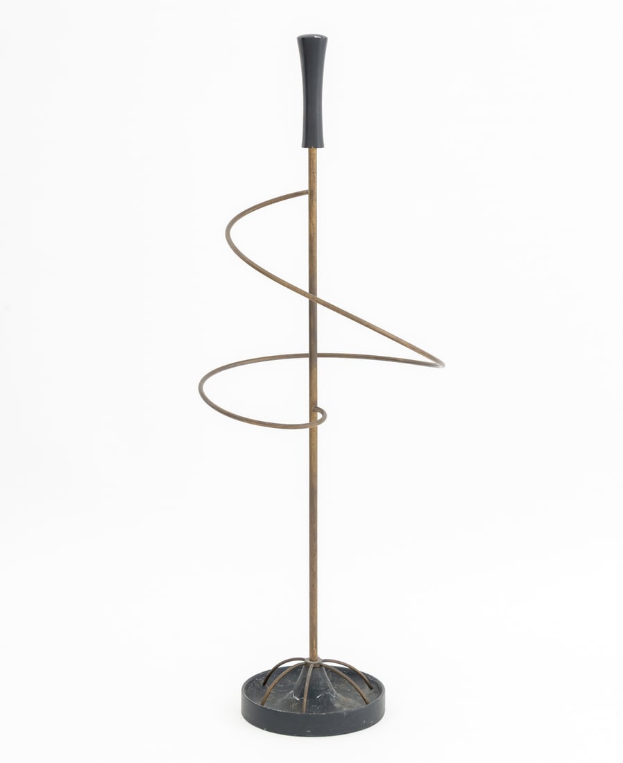 Brass Spiral Umbrella Stand: Brass Spiral Umbrella Stand, with ebonized handle and mounted on circular iron base. 31.5" H x 12" Diameter. Provenance: From a 28 East 70th Street Penthouse Estate. Keywords: Sculptural, Metalwork, V