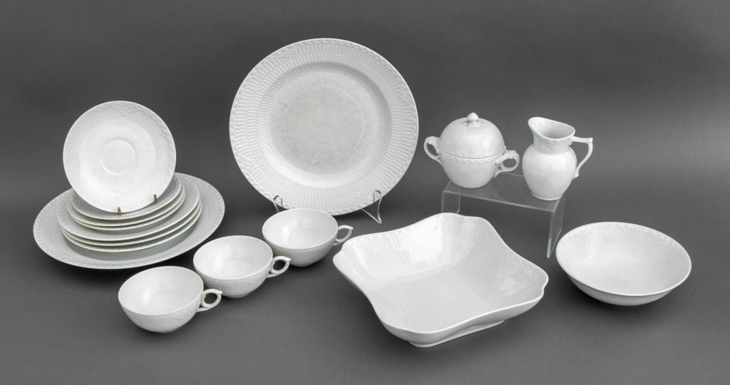 Royal Copenhagen "White Half Lace" Service, 16: Royal Copenhagen "White Half Lace" Partial Porcelain Dinnerware Service, each marked "Royal Copenhagen / Denmark" with three blue waves mark to underside, comprising: three (3) teacups, two (2)