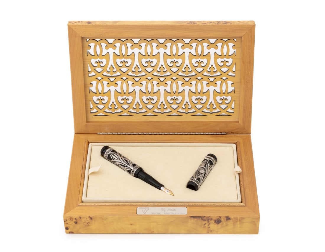Visconti Taj Mahal Limited Edition Fountain Pen: Visconti Taj Mahal Limited Edition Fountain Pen, with 18K gold nib in black resin and silver filigree case, numbered edition "829/888", in fitted burl wood case with plaque and pierced lid. Pen: 6" L;