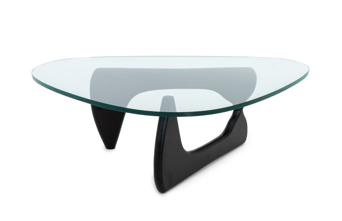 Isamu Noguchi Amorphic Coffee Table: Isamu Noguchi Amorphic Coffee Table, rounded edge triangular glass top above ebonized wood hinged base, marked "Alivar" to the underside of the base. 16.75" H x 50.5" W x 36.75" D. Provenance: From a