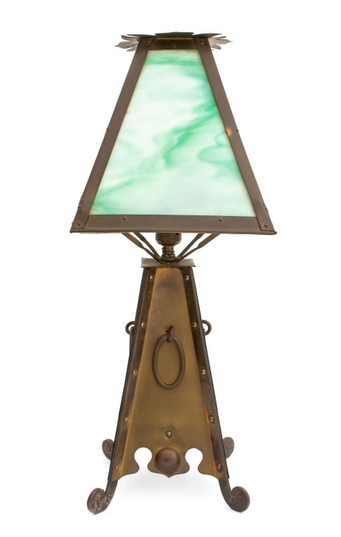 Arts and Crafts Brass and Iron Table Lamp: Arts and Crafts Brass and Iron Table Lamp, early 20th century, with green and white slag glass shade, oval ring handles on four scroll feet. 23.5" H x 9.5" W x 9.5" D. Provenance: From a 333 East