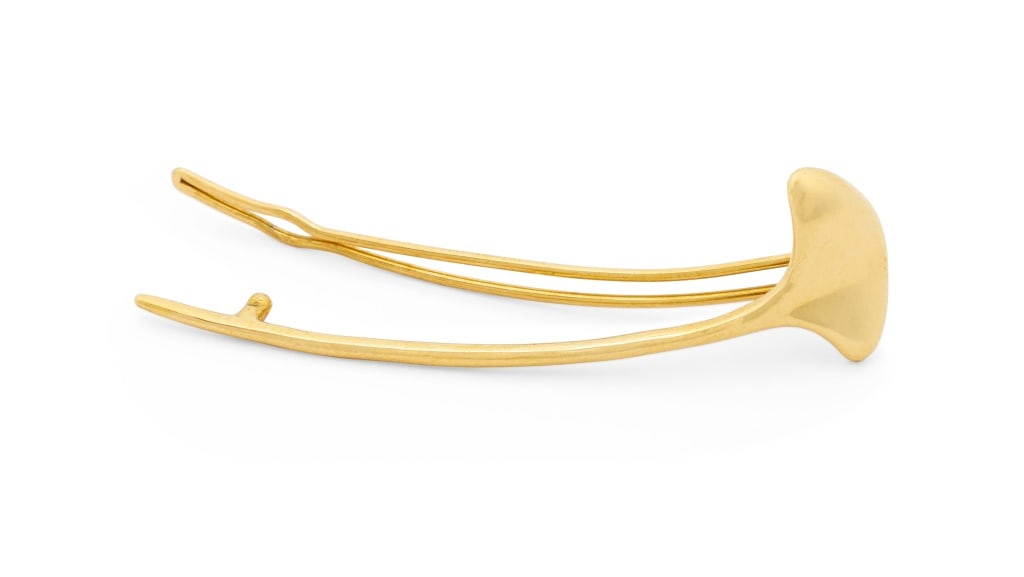 Tiffany & Co. 18K Yellow Gold Hair Clip: Tiffany and Company 18K Yellow Gold Hair Clip, in the form of a stylized ginkgo leaf, worn with hinged wire and post clip, marked: "(c) TIFFANY & CO. 18K". Measuring approx. 2 1/4" x 3/4" across
