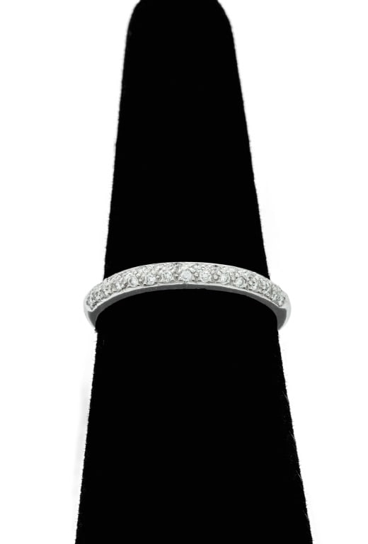 14K White Gold Diamond Pave Thin Band: 14K White Gold Diamond Pave Thin Band, featuring 30 pave set round brilliant cut diamonds, weighing a total of approx. 0.30 carat, marked: "14K with maker's logo". Measuring approx. US size 9 1/2, 2.7