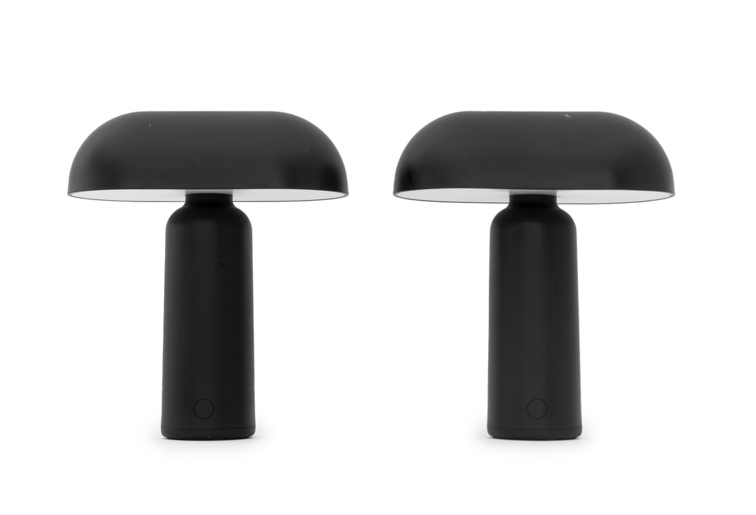 Normann Copenhagen "Porta" Black Table Lamps, Pair: Pair of Normann Copenhagen "Porta" Black Table Lamps, labels to undersides. 9.5" H x 7.75" W x 4.5" D. Provenance: From an East 53rd Street Collection. Keywords: Lighting, Designer, Danish Modern, Den