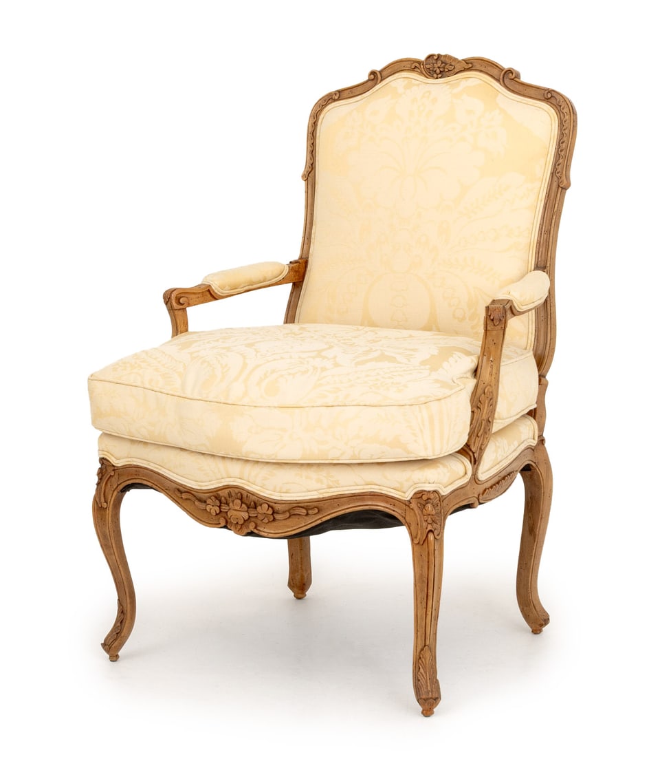 Louis XV Style Wool Damask Upholstered Fauteuil: Louis XV Style Cream Wool Damask Upholstered Walnut Fauteuil, the legs carved with acanthus leaf motif. 38" H x 27" W x 20" D; seat: 19" H. Provenance: From an East 72nd Street Estate. Keywords: Frenc