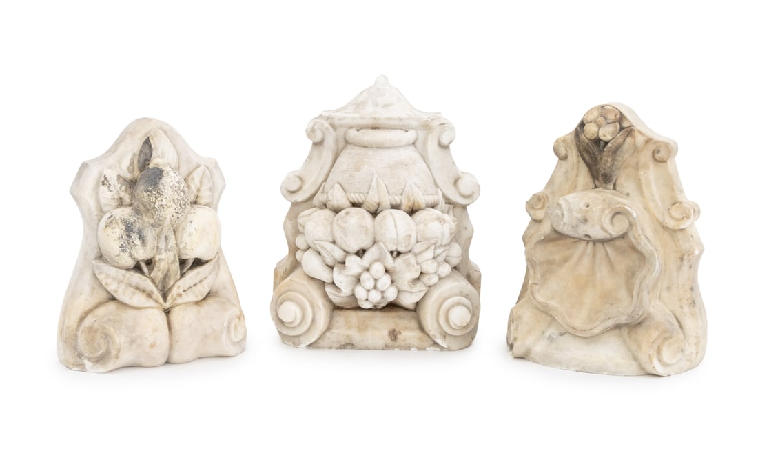 Marble Fireplace Keystones, 3: Group of Three Marble Fireplace Keystones, 19th century, comprising: one fruit basket, one apple and pear, and one shell form. Largest: 11.5" H x 9.25" W x 8.25" D. Provenance: From a Chelsea Townhous