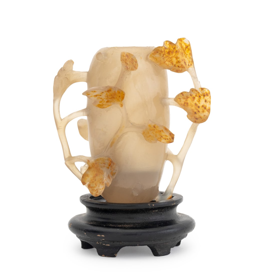 Chinese Carved Agate Vase: Chinese Carved Agate Vase, with pierced flowering vines, on carved wood stand. Vase: 3.5" H x 3.5" W x 1.75" D. Provenance: From a New York City Collection. Keywords: Asian Art, China, Carvings,