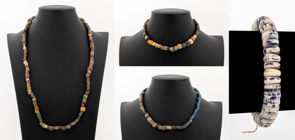 Ancient Glass Beaded Jewelry, 4 Pieces: Group of Four Ancient Glass Beaded Jewelry Pieces, comprising: one necklace with many iridescent glass bead and yellow gold-filled clasp, one bracelet with white and cobalt blue beads, one with blue,