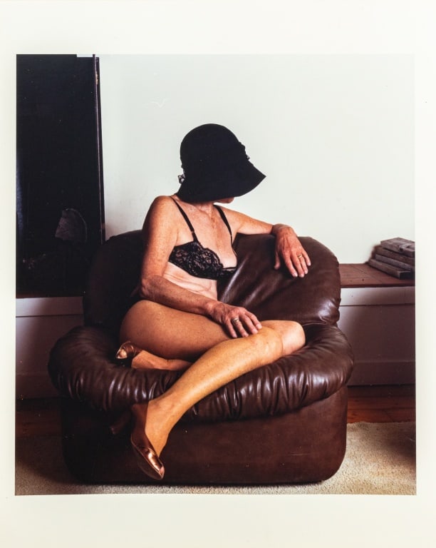 Anne Sager "Women Over 50" Chromogenic Print: Anne Sager (American, 1930-2024), Seated Female Figure, Chromogenic Print in Colors, from the "Women Over 50" series, woman in lingerie seated in leather chair, stamped "Anne Sager 19" verso,
