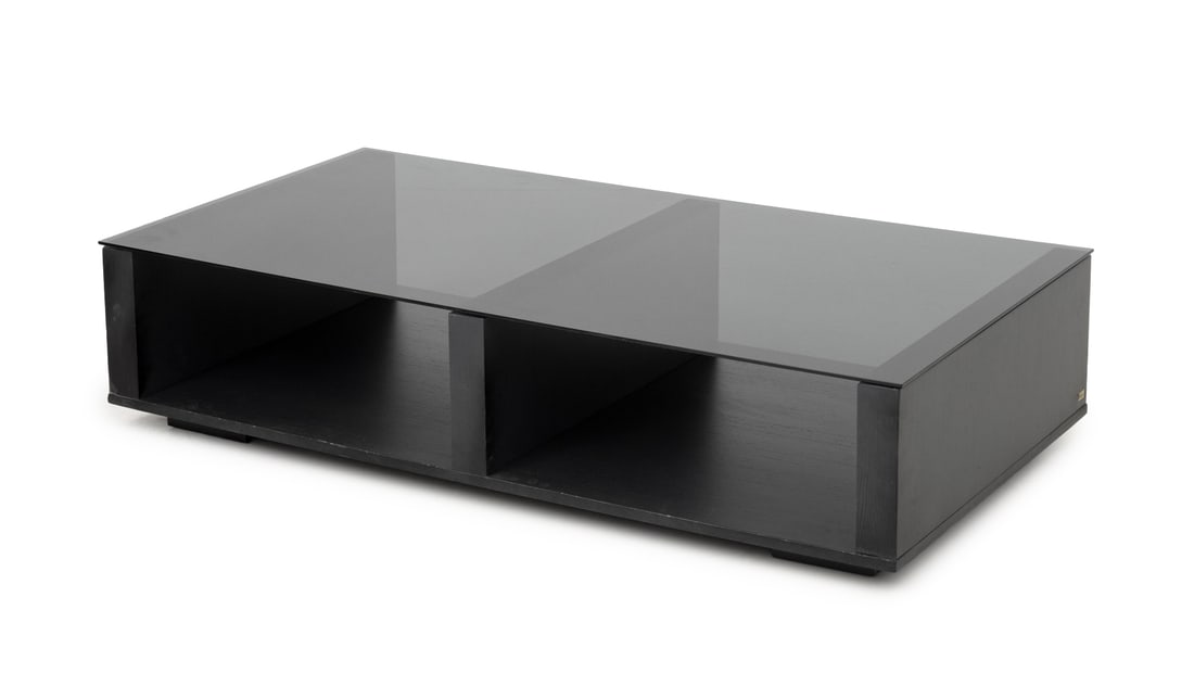 Modern Minimalist Glass Top Black Coffee Table: Modern Minimalist Black Coffee Table, with a smoky glass top on an open base. 11.75" H x 52" W x 27.5" D. Provenance: Property from an 11th Avenue Duplex. Keywords: Modern Furniture, Contemporary desi