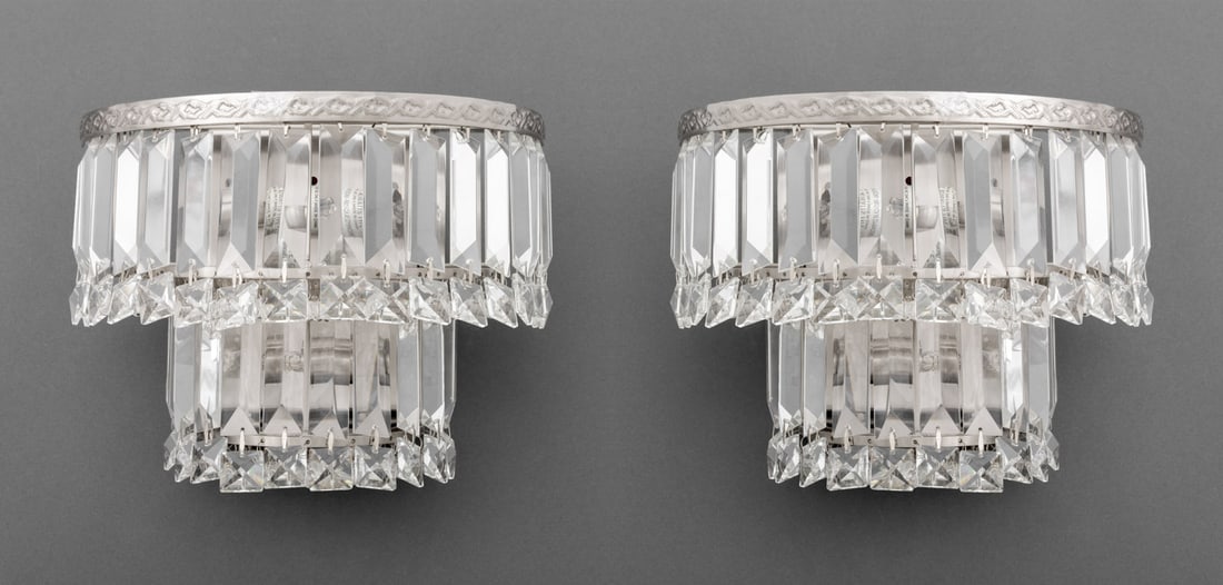 Chrome and Crystal Two-Tier Wall Sconces, Pair: Pair of Chrome and Crystal Two-Tier Wall Sconces, with dangling pendants and beads. 8" H x 10.5" W x 5" D. Provenance: From a New York City Collection. Keywords: Hollywood Regency, Lighting,