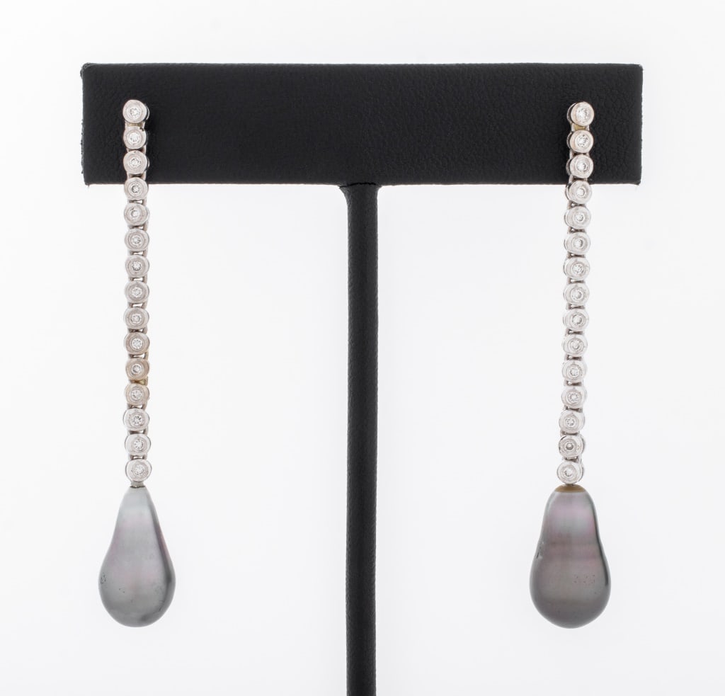 18K Gold Diamond Tahitian Pearl Drop Earrings: Pair of 18K White Gold Diamond Tahitian Pearl Drop Earrings, featuring 30 bezel set round brilliant cut diamonds, weighing a total of approx. 0.45 carat, further adorned with two drop cultured Tahitia